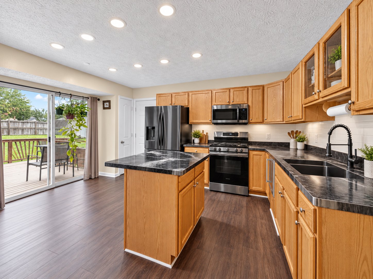 Kitchen opening to the deck